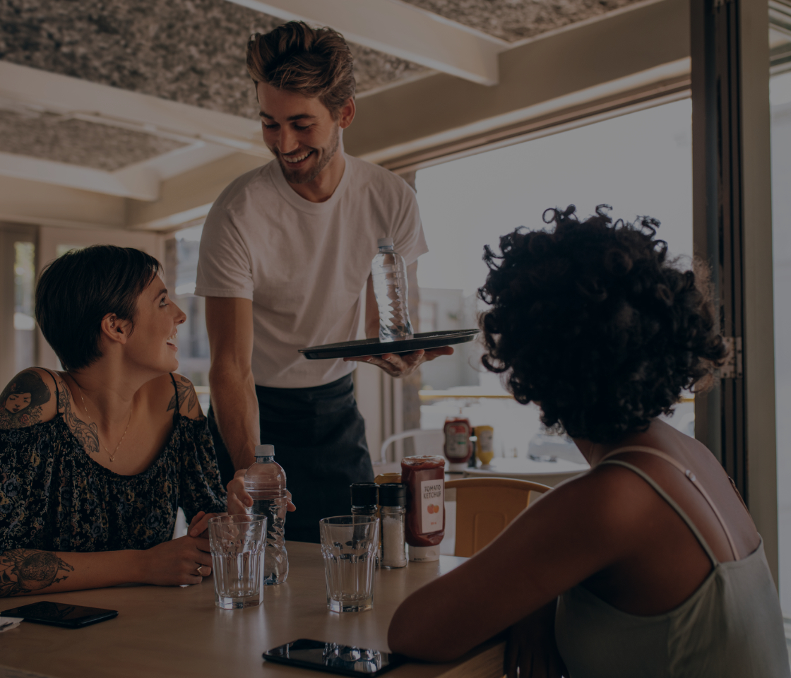 Waiter serving customers